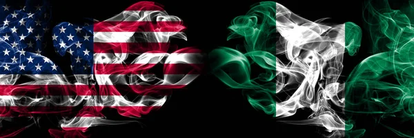 United States of America, USA vs Nigeria, Nigerian background abstract concept peace smokes flags. — Stock Photo, Image