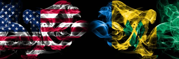 Соединенные Штаты Америки, США против Сент-Винсент и Гренадины фоне абстрактной концепции мира курит флаги . — стоковое фото
