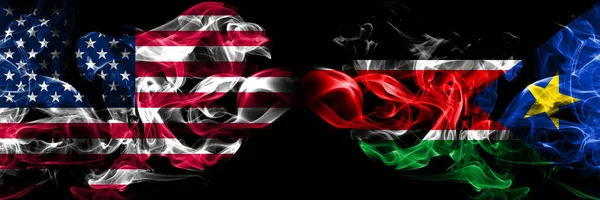 United States of America, USA vs South Sudan background abstract concept peace smokes flags. — Stock Photo, Image