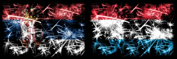 Sérvia, Luxemburgo conceito fogos de artifício espumantes e bandeiras ideia — Fotografia de Stock