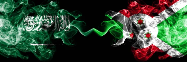 沙特阿拉伯王国对布隆迪，布隆迪烟熏神秘旗帜并排放置。阿拉伯、阿拉伯和布隆迪、布隆迪的浓色丝绸烟旗 — 图库照片