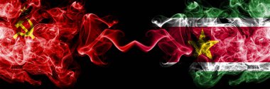 Communist vs Suriname, Surinamese abstract smoky mystic flags placed side by side. Thick colored silky smoke flags of Communism and Suriname, Surinamese clipart