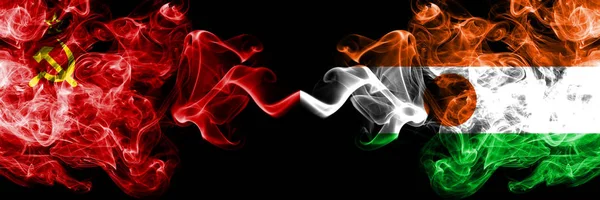 Communist vs Niger, Nigerian abstract smoky mystic flags placed side by side. Thick colored silky smoke flags of Communism and Niger, Nigerian — Stock Photo, Image