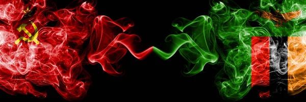 Communist vs Zambia, Zambian abstract smoky mystic flags placed side by side. Thick colored silky smoke flags of Communism and Zambia, Zambian — Stock Photo, Image