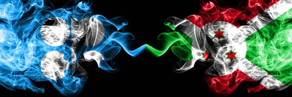 Opec vs Burundi, Burundian abstract smoky mystic flags placed side by side. Thick colored silky smoke flags of Opec and Burundi, Burundian — Stock Photo, Image