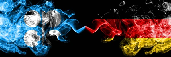 Opec vs Németország, német elvont füstös misztikus zászlók egymás mellett. Sűrű színű selymes füst zászlók Opec és Németország, Német — Stock Fotó