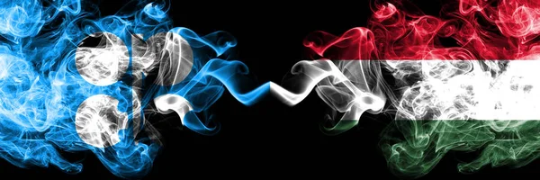 Opec vs Hungary, Hungarian abstract smoky mystic flags placed side by side. Thick colored silky smoke flags of Opec and Hungary, Hungarian — Stock Photo, Image