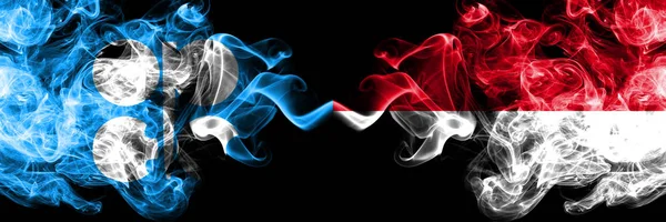 Opec vs Μονακό, Monacan αφηρημένη καπνιστή μυστικιστική σημαίες τοποθετούνται δίπλα-δίπλα. Χοντρές χρωματιστές μεταξένιες σημαίες καπνού του Opec και του Μονακό, Monacan — Φωτογραφία Αρχείου