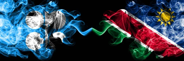 Opec vs Namibië, Namibische abstracte rokerige mystieke vlaggen naast elkaar geplaatst. Dikke gekleurde zijdeachtige rook vlaggen van Opec en Namibië, NamibiÃ " — Stockfoto