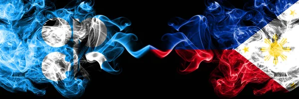 Opec vs Philippines, Filipino abstract smoky mystic flags placed side by side. Thick colored silky smoke flags of Opec and Philippines, Filipino — Stock Photo, Image