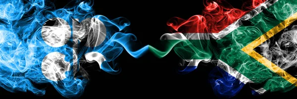 Opec vs Zuid-Afrika, Afrikaanse abstracte rokerige mystieke vlaggen naast elkaar geplaatst. Dikke gekleurde zijdeachtige rook vlaggen van Opec en Zuid-Afrika, Afrikaanse — Stockfoto