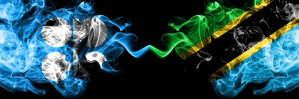 Opec vs Tanzania, Tanzanian abstrakta rökiga mystiska flaggor placerade sida vid sida. Tjock färgad silkeslen rök flaggor Opec och Tanzania, Tanzanian — Stockfoto