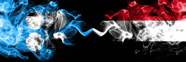 Opec vs Υεμένη, Υεμένια αφηρημένη καπνιστή μυστικιστική σημαίες τοποθετούνται δίπλα-δίπλα. Χοντρές χρωματιστές μεταξένιες σημαίες καπνού του Opec και της Υεμένης, Υεμένη — Φωτογραφία Αρχείου