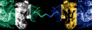 Nijerya Barbados 'a karşı, Barbadoslu soyut dumanlı mistik bayraklar yan yana. Nijerya ve Barbados 'un kalın renkli dumanlı bayrakları, Barbadoslu