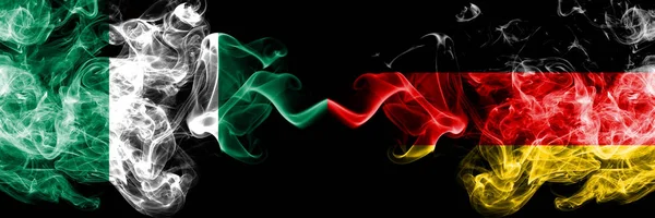 Nigeria vs Germany, German abstract smoky mystic flags placed side by side. Thick colored silky smoke flags of Nigerian and Germany, German — Stock Photo, Image