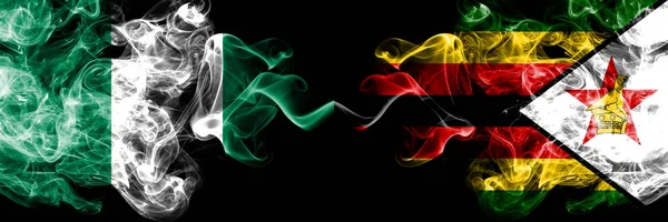 尼日利亚对津巴布韦，津巴布韦抽象的烟熏神秘旗并排放置。 津巴布韦，尼日利亚和津巴布韦，浓密的彩色丝状烟雾旗 — 图库照片