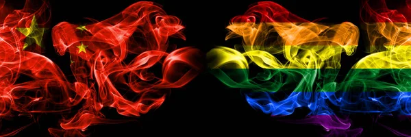 China vs Gay pride smoke flags placed side by side. Thick colored silky smoke flags of Chinese and Gay pride — Stock Photo, Image