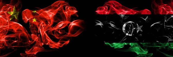 China vs Libya, Libyan smoke flags placed side by side. Thick colored silky smoke flags of Chinese and Libya, Libyan — Stock Photo, Image