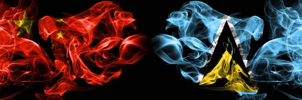 Bandeiras de fumaça China vs Santa Lúcia colocadas lado a lado. Bandeiras de fumo sedoso de cor grossa de chinês e Santa Lúcia — Fotografia de Stock