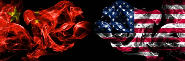 China vs United States of America, American smoke flags placed side by side. Thick colored silky smoke flags of Chinese and United States of America, American