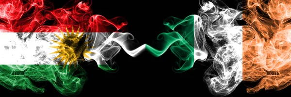 Kurdistan vs Ireland, Irish smoke flags placed side by side. Thi — Stock Photo, Image