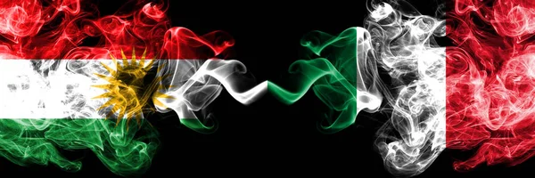 Kurdistan vs Italy, Italian smoke flags placed side by side. Thi — Stock Photo, Image