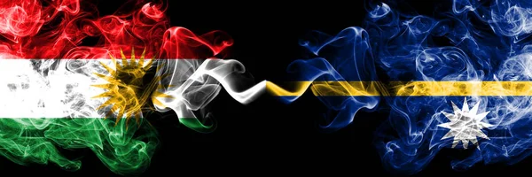 Kurdistan vs Nauru smoke flags placed side by side. Thick colore — Stock Photo, Image