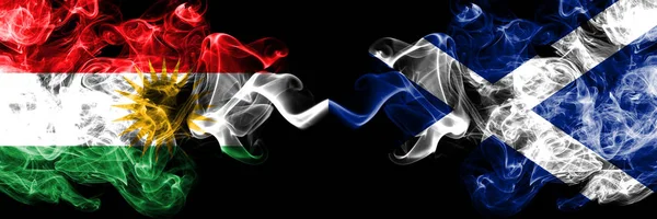 Kurdistan vs Scotland, Scottish smoke flags placed side by side. — Stock Photo, Image