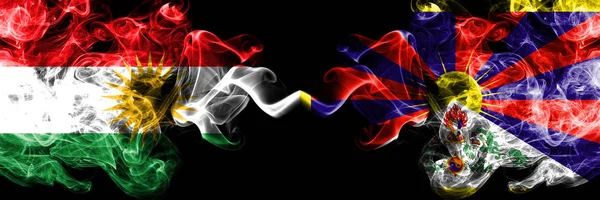 Kurdistan vs Tibet, Tibetan smoke flags placed side by side. Thi — Stock Photo, Image