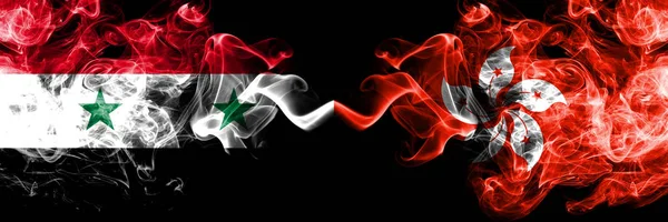 Syria vs Hong Kong, China smoke flags placed side by side. Thick colored silky smoke flags of Syrian and Hong Kong, China