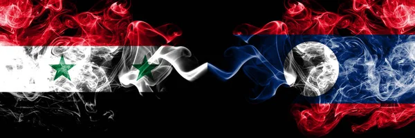 Syria vs Laos smoke flags placed side by side. Thick colored silky smoke flags of Syrian and Laos — Stock Photo, Image