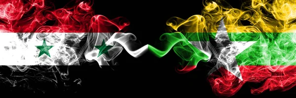 시리아 vs 미얀마 연기 플래그 나란히 배치. 두꺼운은 시리아와 미얀마의 부드러운 연기 플래그 색 — 스톡 사진