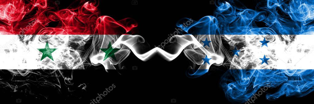 Syria vs Honduras, Honduran smoke flags placed side by side. Thick colored silky smoke flags of Syrian and Honduras, Honduran