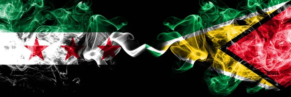 Syrian Arab Republic vs Guyana, Guyanese smoke flags placed side by side. Thick colored silky smoke flags of Syria opposition and Guyana, Guyanese — 스톡 사진