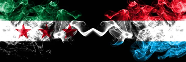 Syrian Arab Republic vs Luxembourg smoke flags placed side by side. Thick colored silky smoke flags of Syria opposition and Luxembourg — Stock Photo, Image