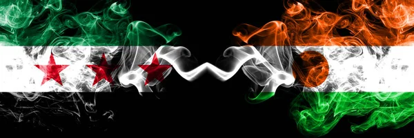 Syrian Arab Republic vs Niger, Nigerian smoke flags placed side by side. Thick colored silky smoke flags of Syria opposition and Niger, Nigerian — Stock Photo, Image