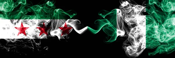 Syrian Arab Republic vs Nigeria, Nigerian smoke flags placed side by side. Thick colored silky smoke flags of Syria opposition and Nigeria, Nigerian — Stock Photo, Image