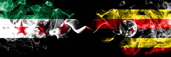 República Árabe Siria vs Uganda, banderas de humo de Uganda colocadas una al lado de la otra. Banderas de humo sedoso de color grueso de la oposición siria y Uganda, Uganda —  Fotos de Stock