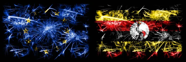 Eu, União Europeia vs Uganda, celebração do ano novo ugandense fogos de artifício espumantes bandeiras fundo conceito. Combinação de dois pavilhões dos Estados . — Fotografia de Stock