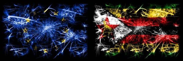 Eu, European union vs Zimbabwe, Zimbabwean new year celebration sparkling fireworks flags concept background. Combination of two states flags. — Stock Photo, Image