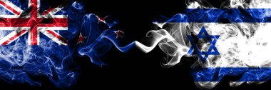 Yeni Zelanda İsrail 'e karşı, yan yana yerleştirilmiş İsrail' in dumanlı mistik bayrakları. Kalın renkli ipeksi soyut duman bayrakları