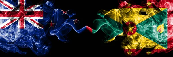 Yeni Zelanda, Grenada 'ya karşı yan yana yerleştirilmiş gizemli bayraklar. Kalın renkli ipeksi soyut duman bayrakları