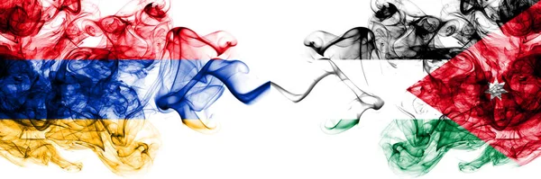 亚美尼亚对约旦 约旦烟熏神秘的旗帜并排放置 浓密的彩色丝状抽象烟旗 — 图库照片