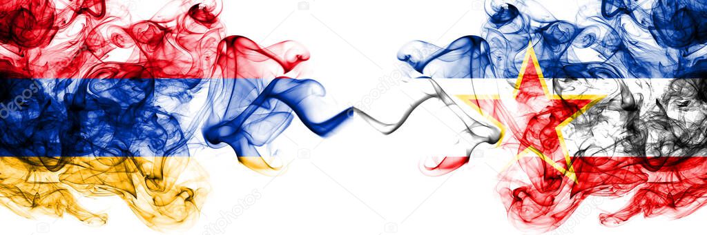 Armenia vs Yugoslavia, Yugoslavian smoky mystic flags placed side by side. Thick colored silky abstract smoke flags