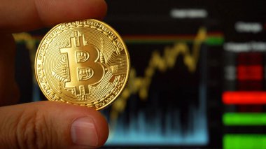 Dijital para birimi Bitcoin büyüyen grafikler önünde