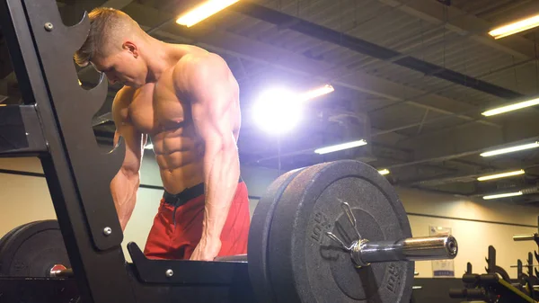 Man athlete taking barbell for starting exercise — Stok fotoğraf