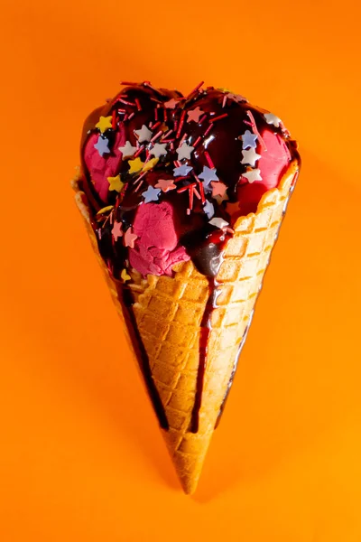 Tasty big cherry ice-cream with chocolate topping — Stock Photo, Image