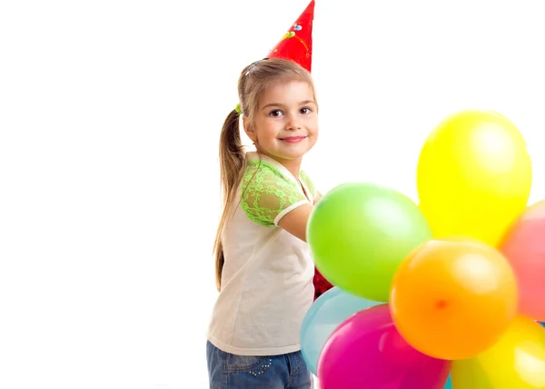 Menina sorridente comemorando aniversário com balões multicoloridos — Fotografia de Stock