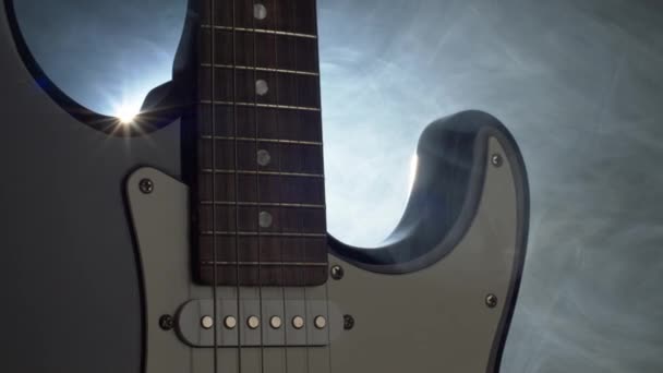 Electric guitar on the stage in soffits light and smoke before rock concert. Panning shot, 4K — Stock Video