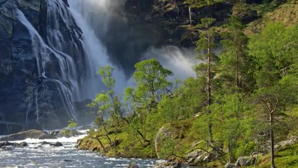 Tilt shot of a waterfall in the central part of Norway. Spring summer sunny day. 4K, UHD — Stock Video